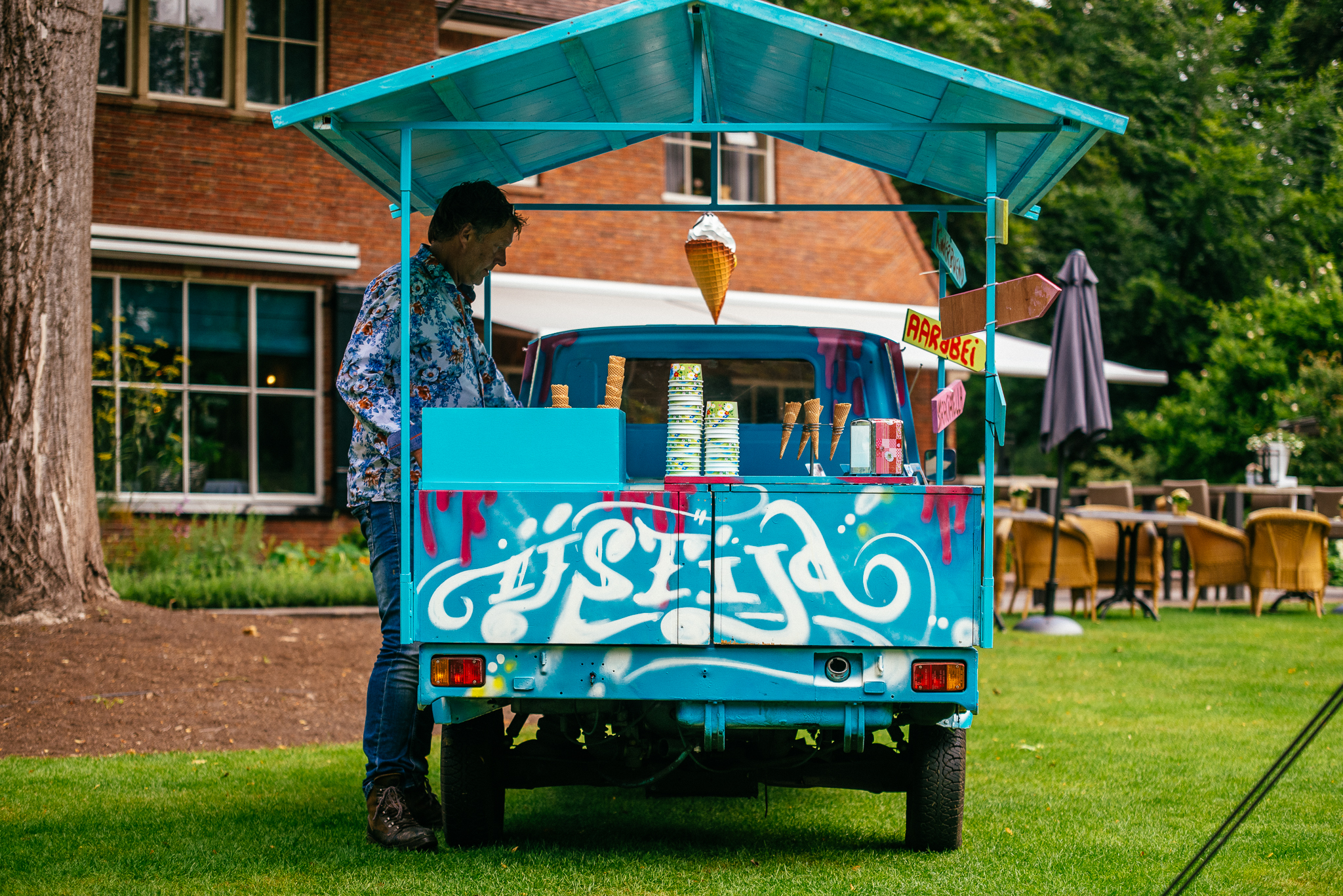 Diverse customers enjoying ice cream from cart at festival